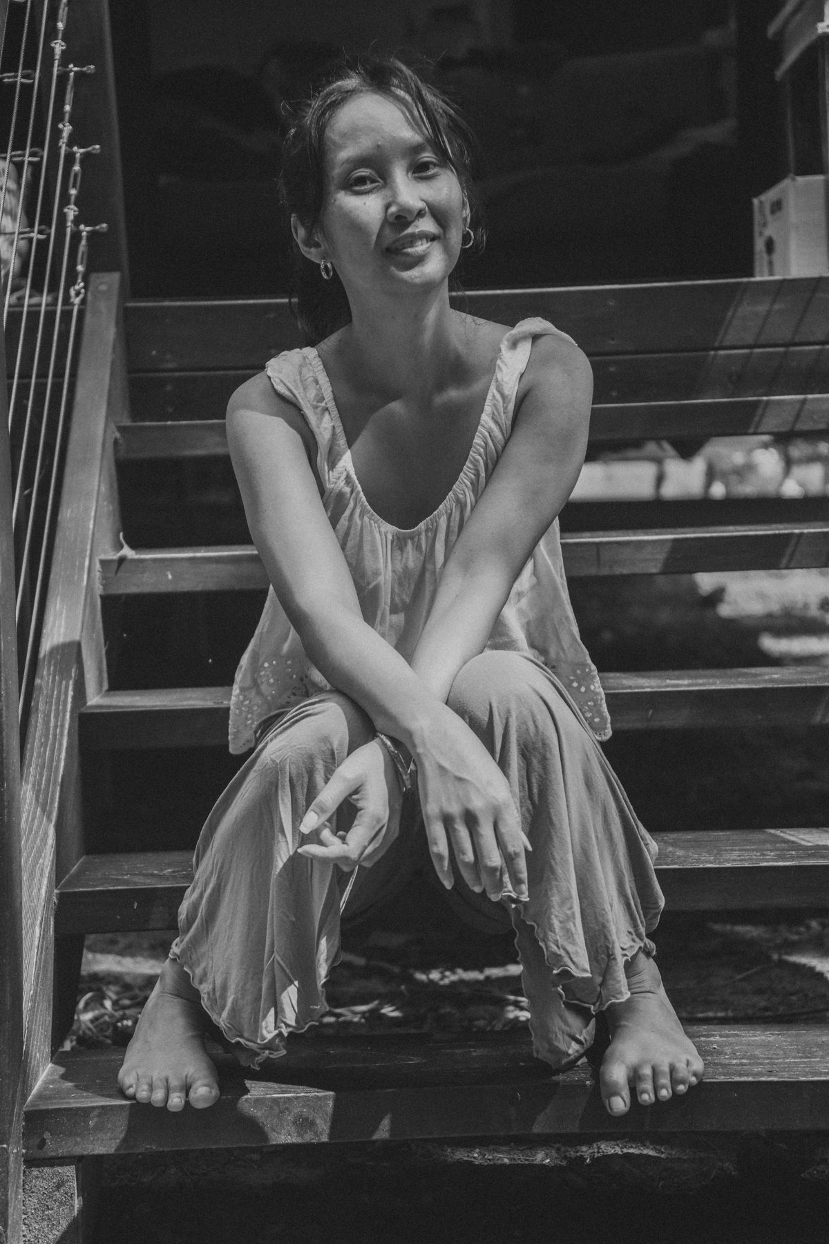 Sofia seated on timber steps